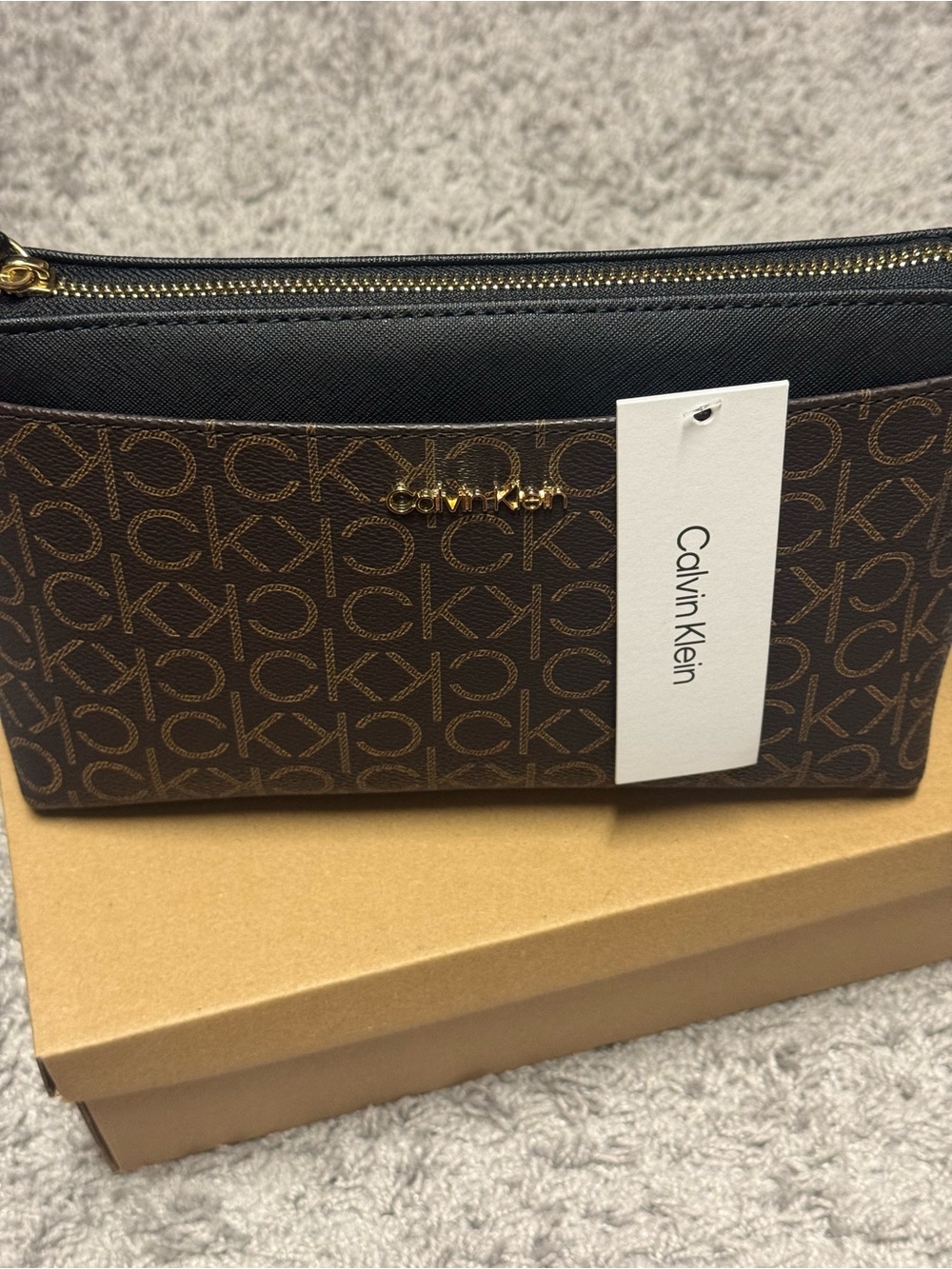 Calvin Klein Brown Logo Zip Wristlet with Black Trim and Gold Hardware